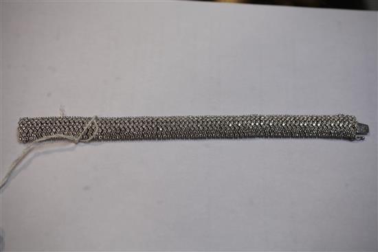 A modern 18ct white gold and diamond encrusted bracelet, 18cm.